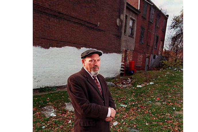 Bill Wade/Post-Gazette Playwright August Wilson in the Hill District on Bedford Avenue in front of his childhood home. 