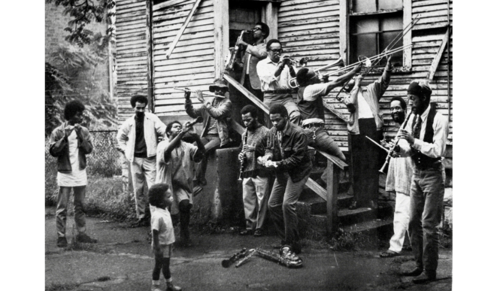 Wadsworth Jarrell, New Orleans–style group photo in painter Wadsworth Jarrell’s backyard, c. 1968 - Image Courtesy of Black Contemporary Art 